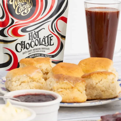 Devon scones with jam, clotted cream and a glass of hot chocolate